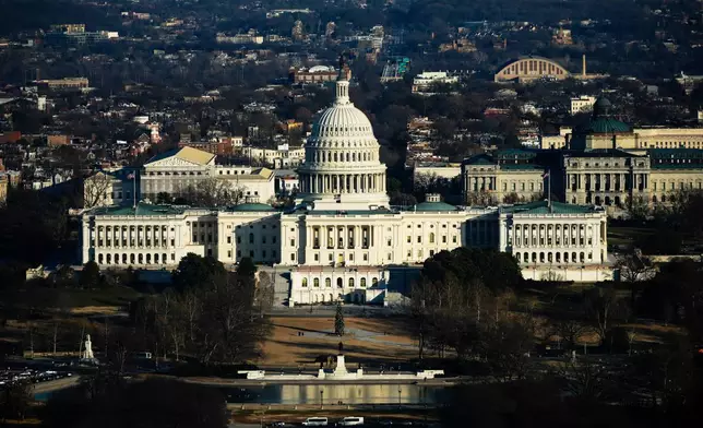 The Capitol is seen from the Washington Monument, Tuesday, Dec. 16, 2025, in Washington. (AP Photo/Julia Demaree Nikhinson)