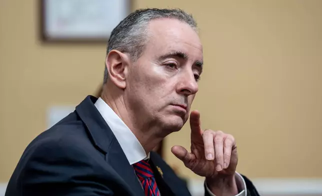 FILE - Rep. Brian Fitzpatrick, R-Pa., listens to debate as the House Rules Committee meets to prepare Republican legislation to address health care affordability, at the Capitol in Washington, Dec. 16, 2025. (AP Photo/J. Scott Applewhite, File)
