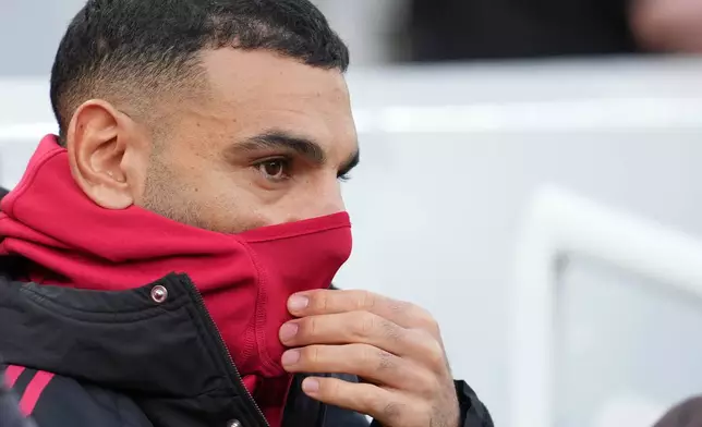 Liverpool's Mohamed Salah sits on the bench before the English Premier League soccer match between Liverpool and Brighton and Hove Albion in Liverpool, England, Saturday, Dec. 13, 2025. (AP Photo/Jon Super)