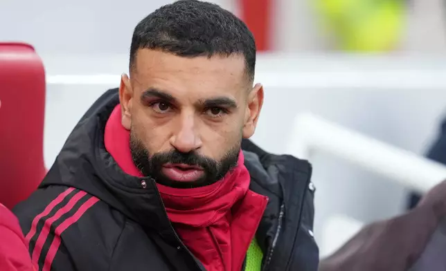 Liverpool's Mohamed Salah sits on the bench before the English Premier League soccer match between Liverpool and Brighton and Hove Albion in Liverpool, England, Saturday, Dec. 13, 2025. (AP Photo/Jon Super)