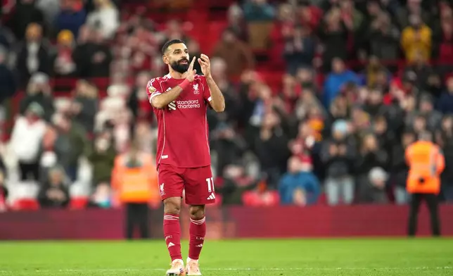 Liverpool's Mohamed Salah applauds supporters after the English Premier League soccer match between Liverpool and Brighton and Hove Albion in Liverpool, England, Saturday, Dec. 13, 2025. (AP Photo/Jon Super)