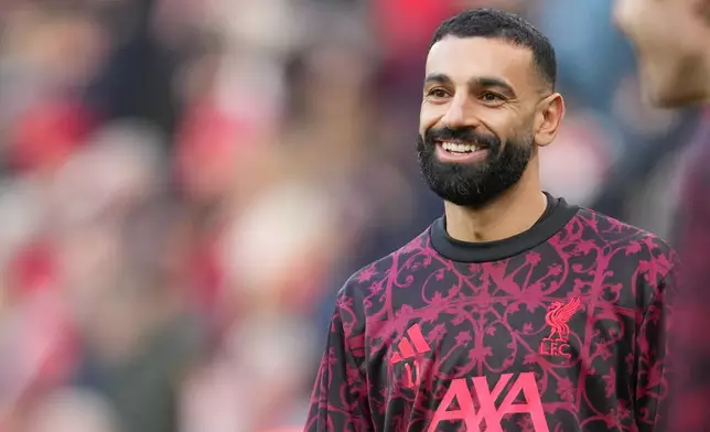 Liverpool's Mohamed Salah warms up prior to the English Premier League soccer match between Liverpool and Brighton and Hove Albion in Liverpool, England, Saturday, Dec. 13, 2025. (AP Photo/Jon Super)