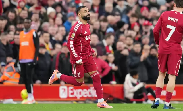 Liverpool's Mohamed Salah, centre, during the English Premier League soccer match between Liverpool and Brighton and Hove Albion in Liverpool, England, Saturday, Dec. 13, 2025. (AP Photo/Jon Super)