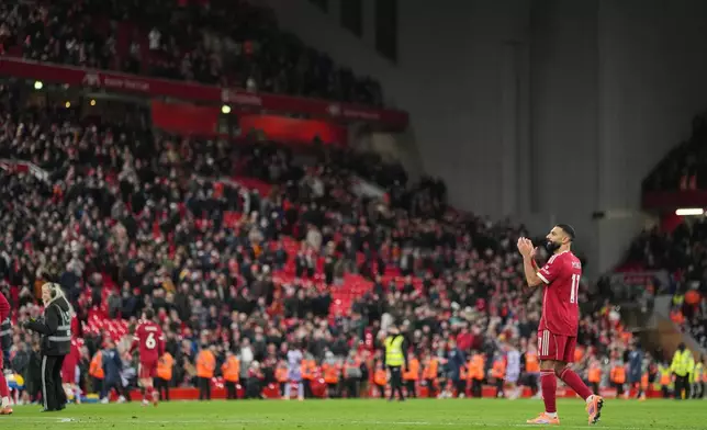 Liverpool's Mohamed Salah applauds supporters after the English Premier League soccer match between Liverpool and Brighton and Hove Albion in Liverpool, England, Saturday, Dec. 13, 2025. (AP Photo/Jon Super)