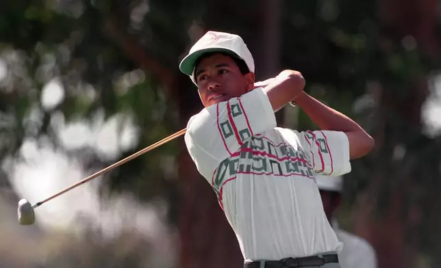 FILE - Amateur golfer Tiger Woods tees off at the 11th hole during the pro-m for the Los Angeles Open golf tournament at Riviera Country Club in Los Angeles, Feb. 26, 1992. (AP Photo/Bob Galbraith, File)