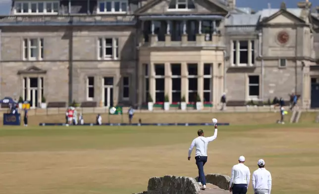 FILE - Tiger Woods of the U.S. gestures to the crowd at the end of his second round of the British Open golf championship on the Old Course, in St. Andrews, Scotland, Friday July 15, 2022. (AP Photo/Peter Morrison, File)