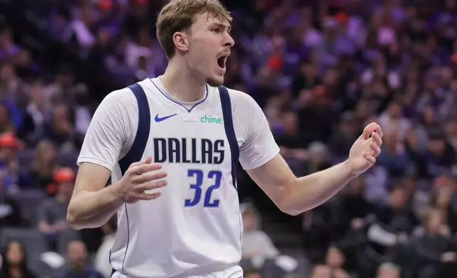 Dallas Mavericks forward Cooper Flagg reacts after being called for a foul during the first half of an NBA basketball game against the Sacramento Kings, Saturday, Dec. 27, 2025, in Sacramento, Calif. (AP Photo/Scott Marshall)