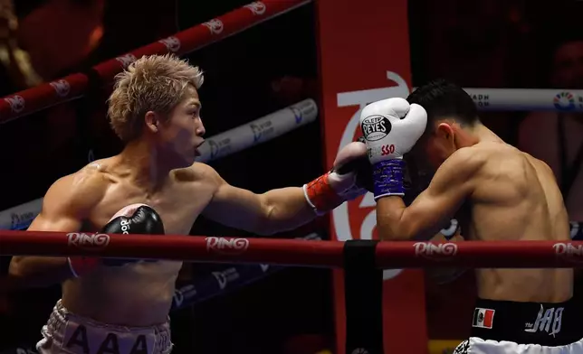 Japan's Naoya Inoue, left, punches Alan Picasso of Mexico during a boxing match for the unified WBC IBF WBO WBA super bantamweight world title in Riyadh, Saudi Arabia, Saturday, Dec. 27, 2025. (AP Photo)