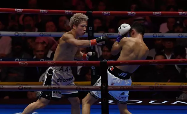 Japan's Naoya Inoue, left, fights Alan Picasso of Mexico during a boxing match for the unified WBC IBF WBO WBA super bantamweight world title in Riyadh, Saudi Arabia, Saturday, Dec. 27, 2025. (AP Photo)