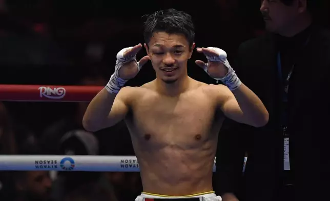 Japan's Junto Nakatani celebrates after beating Sebastian Hernandez Reyes of Mexico during a super-bantamweight bout in Riyadh, Saudi Arabia, Saturday, Dec. 27, 2025. (AP Photo)