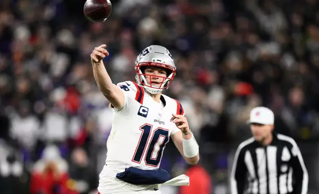 New England Patriots quarterback Drake Maye (10) passes against the Baltimore Ravens during the first half of an NFL football game, Sunday, Dec. 21, 2025, in Baltimore. (AP Photo/Nick Wass)