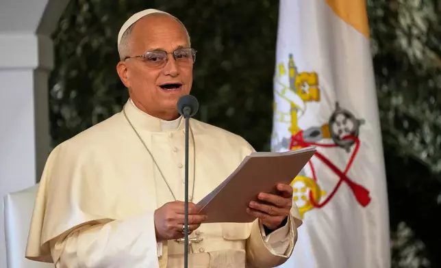 Pope Leo XIV reads a speech during a farewell ceremony at the Beirut International Airport in Beirut, Lebanon, Tuesday, Dec. 2, 12025.(AP Photo/Hussein Malla)
