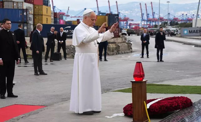 Pope Leo XIV holds a moment of prayer at the site of the 2020 Beirut port explosion in Beirut, Lebanon, Tuesday, Dec. 2, 2025. (AP Photo/Domenico Stinellis)
