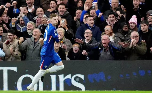 Chelsea's Cole Palmer celebrates after scoring his sides first goal during the English Premier League soccer match between Chelsea and Everton in London, Saturday, Dec. 13, 2025. (Adam Davy/PA via AP)