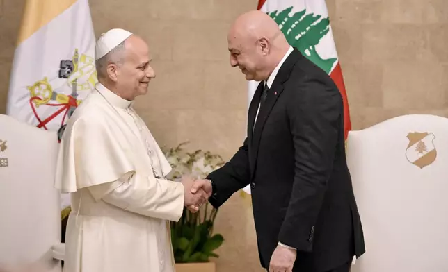 Pope Leo XIV is greeted by Lebanese President Joseph Aoun upon his arrival at the Presidential Palace in Beirut, Lebanon, Sunday, Nov. 30, 2025. (Alessandro Di Meo/Pool Via AP)