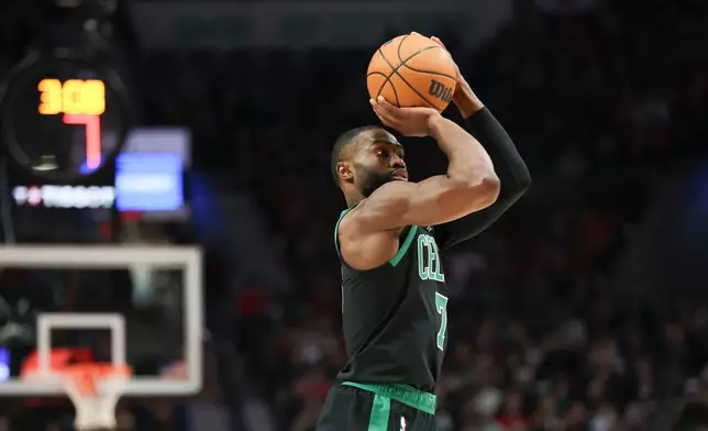 Boston Celtics guard Jaylen Brown shoots against the Portland Trail Blazers during the first half of an NBA basketball game, Sunday, Dec. 28, 2025, in Portland, Ore. (AP Photo/Amanda Loman)