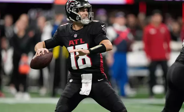 Atlanta Falcons quarterback Kirk Cousins throws against the Seattle Seahawks during the first half of an NFL football game, Sunday, Dec. 7, 2025, in Atlanta. (AP Photo/Brynn Anderson)