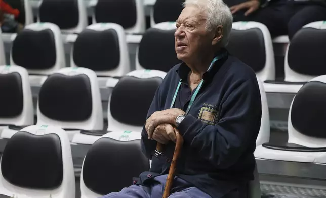 Former Italian tennis legend and Davis Cup winner Nicola Pietrangeli sits during the tennis Davis Cup final 8 match between Brazil's Joao Fonseca and Netherland's Botic Van De Zandschulp at the Unipol arena, in Bologna, northern Italy, Thursday, September 12, 2024. (Michele Nucci/LaPresse via AP)