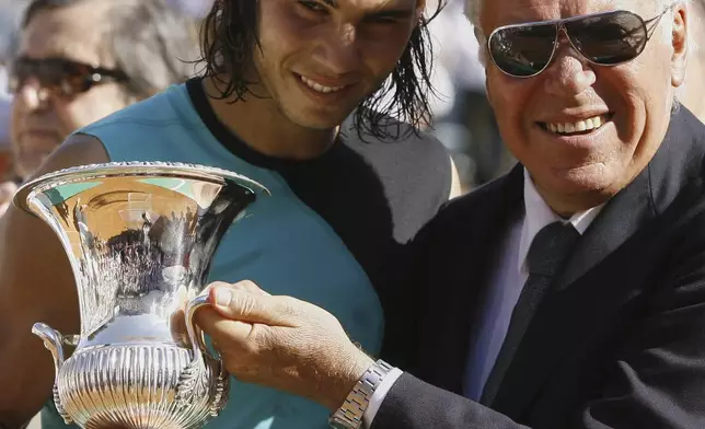 FILE - Spain's Rafael Nadal, left, holds the trophy he was given by Italian tennis legend Nicola Pietrangeli, after winning the Rome Masters tennis tournament at Rome's Foro Italico, Sunday, May 13, 2007. (AP Photo/Alessandra Tarantino, file)