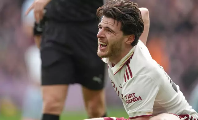 Arsenal's Declan Rice reacts during the English Premier League soccer match between Aston Villa and Arsenal in Birmingham, England, Saturday, Dec. 6, 2025. (AP Photo/Dave Shopland)