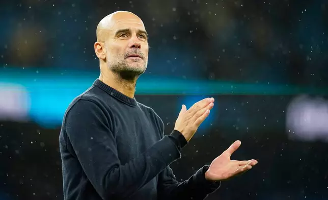 Manchester City's head coach Pep Guardiola applauds fans after the English Premier League soccer match between Manchester City and Sunderland in Manchester, England, Saturday, Dec. 6, 2025. (AP Photo/Dave Thompson)