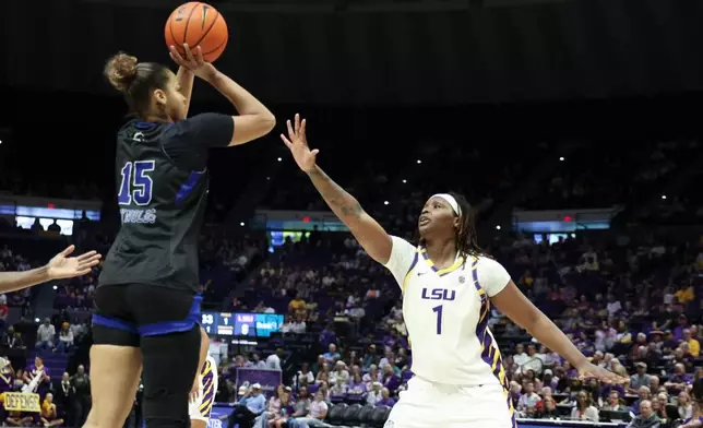 Texas-Arlington forward Mila Reynolds (15) shoots a jumper over LSU forward Amiya Joyner (1) in the first half of an NCAA women's college basketball game between Texas-Arlington and LSU in Baton Rouge, La., Sunday, Dec. 21, 2025. (AP Photo/Peter Forest)