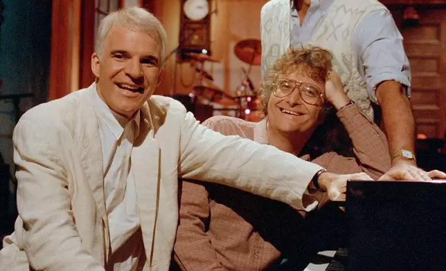 FILE - Steve Martin, Randy Newman and Chevy Chase rehearse a musical number at the NBC studios in New York's Rockefeller Center, Dec. 5, 1986, in preparation for their reunion on "Saturday Night Live." (AP Photo/Richard Drew, File)