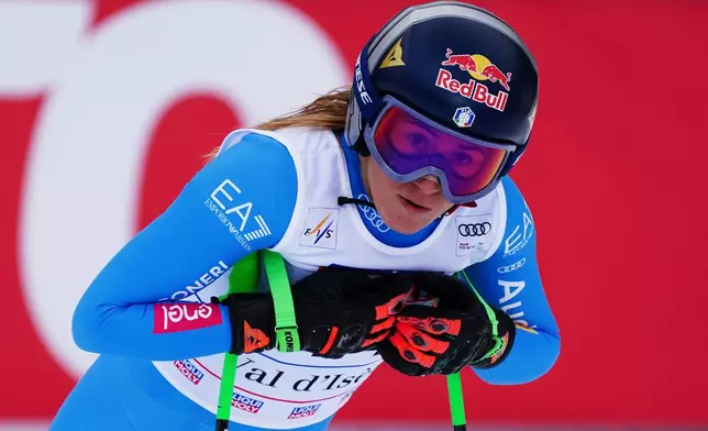 Italy's Sofia Goggia reacts at the finish area of an alpine ski, women's World Cup downhill, in Val D'Isere, France, Saturday, Dec. 20, 2025. (AP Photo/Pier Marco Tacca)