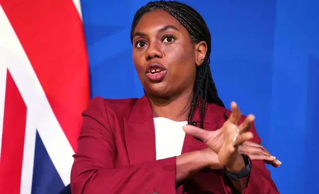 Britain's Conservative Party leader Kemi Badenoch gestures during an "in conversation" event with journalist Liam Halligan, in central London, Monday, Dec. 1, 2025. (Jordan Pettitt/PA via AP)