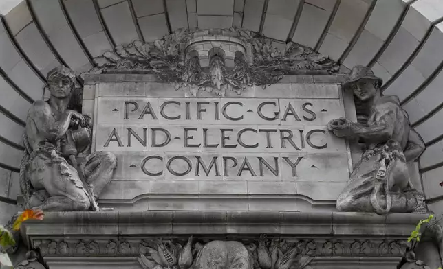 FILE - A Pacific Gas &amp; Electric sign is displayed on the exterior of a PG&amp;E building in San Francisco on April 16, 2020. (AP Photo/Jeff Chiu, File)