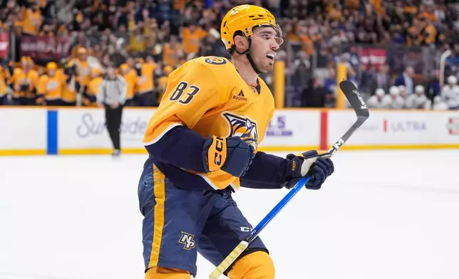 Nashville Predators defenseman Adam Wilsby (83) celebrates his goal during the second period of an NHL hockey game against the Toronto Maple Leafs, Saturday, Dec. 20, 2025, in Nashville, Tenn. (AP Photo/George Walker IV)