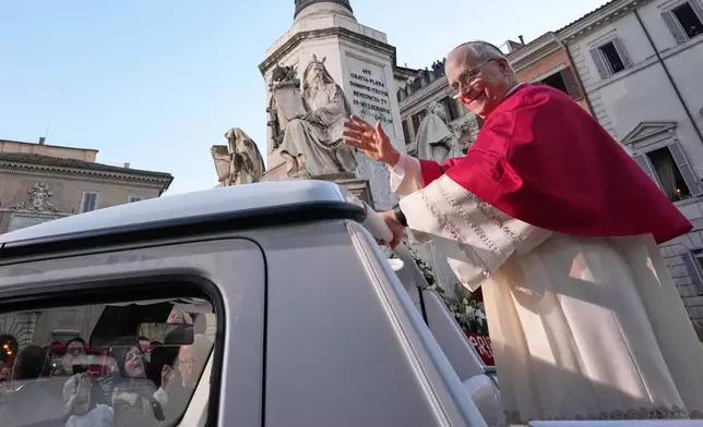 Pope Leo XIV leaves after praying in front of the statue of the Virgin Mary next to the Spanish Steps in Rome, Monday, Dec. 8, 2025, on the Catholic Feast of the Immaculate Conception. (AP Photo/Andrew Medichini)