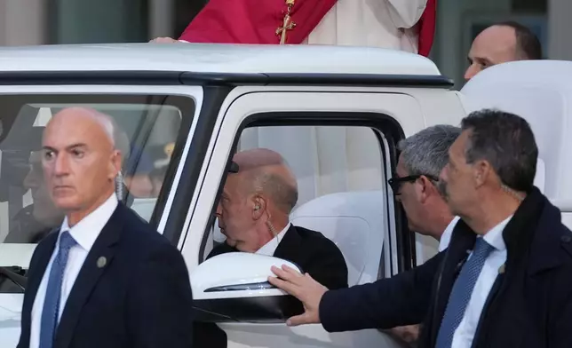 Pope Leo XIV leaves after praying in front of the statue of the Virgin Mary next to the Spanish Steps in Rome, Monday, Dec. 8, 2025, on the Catholic Feast of the Immaculate Conception. (AP Photo/Andrew Medichini)