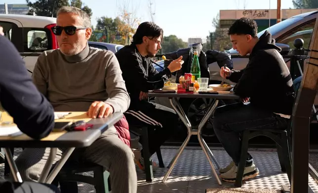 Customers enjoy their pasta at a restaurant in Rome, Wednesday, Dec. 10, 2025. (AP Photo/Gregorio Borgia)