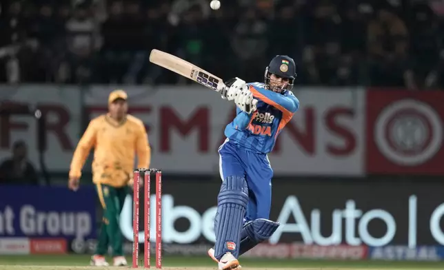 India's Tilak Varma plays a shot during the third T20 cricket match between India and South Africa in Dharamshala, India, Sunday, Dec. 14, 2025. (AP Photo/Ashwini Bhatia)