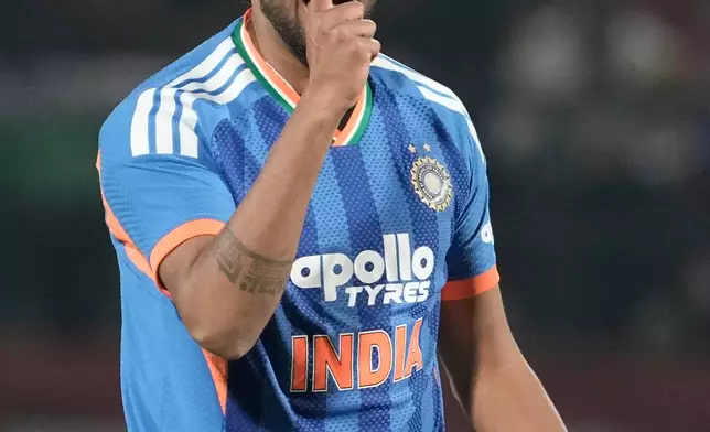 India's Harshit Rana celebrates the wicket of South Africa's Quinton de Kock during the third T20 cricket match between India and South Africa in Dharamshala, India, Sunday, Dec. 14, 2025. (AP Photo/Ashwini Bhatia)