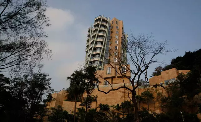 FILE - The luxury residential building "Opus Hong Kong," designed by Frank Gehry, stands in Mid-Levels East of Hong Kong, Nov. 13, 2012. (AP Photo/Kin Cheung, File)