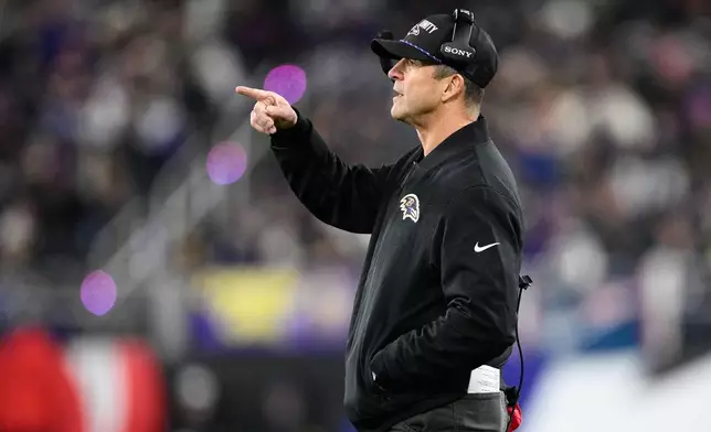 Baltimore Ravens head coach John Harbaugh gestures during the first half of an NFL football game against the New England Patriots, Sunday, Dec. 21, 2025, in Baltimore. (AP Photo/Nick Wass)