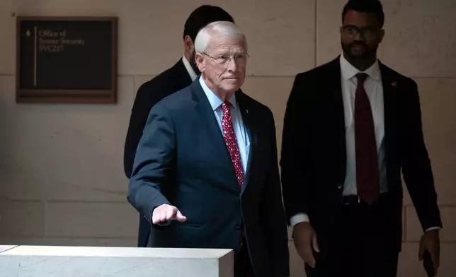 Senate Armed Services Committee chairman Sen. Roger Wicker, R-Miss., leaves after a meeting with U.S. Navy Adm. Frank M. Bradley on Capitol Hill, Thursday, Dec. 4, 2025, in Washington. (AP Photo/Mark Schiefelbein)