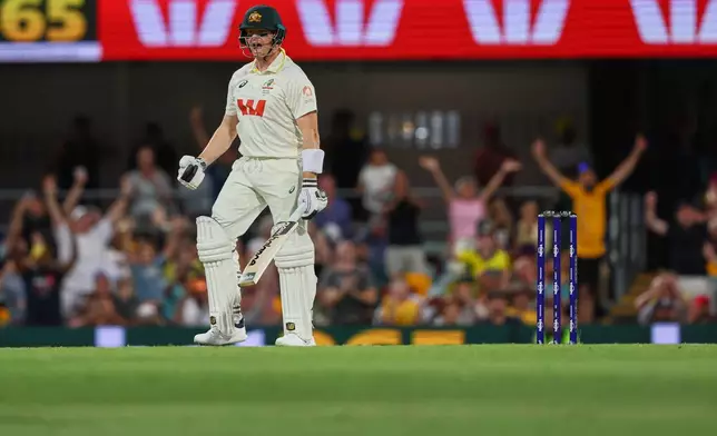 Australia's captain Steve Smith reacts after winning the second Ashes cricket test match between Australia and England in Brisbane, Sunday, Dec. 7, 2025.. (AP Photo/Tertius Pickard)