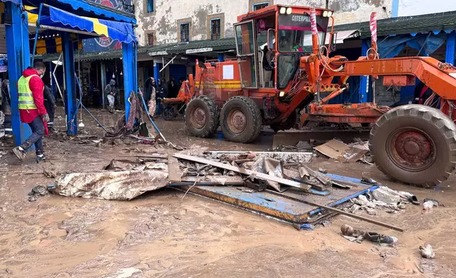 People inspect the damage caused by flash floods in Safi, Morocco, Monday, Dec. 15, 2025. (AP Photo/Abderrazak Gouach)