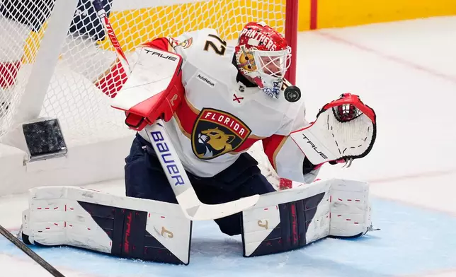 Florida Panthers goaltender Sergei Bobrovsky defends against a shot by the Dallas Stars in the first period of an NHL hockey game in Dallas, Saturday, Dec. 13, 2025. (AP Photo/Tony Gutierrez)