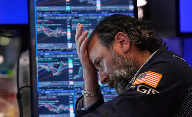 FILE - Specialist Michael Pistillo works on the floor of the New York Stock Exchange, Tuesday, July 8, 2025. (AP Photo/Richard Drew, File)