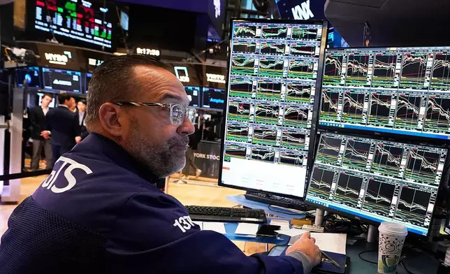 FILE - Specialist Anthony Matesic works on the floor of the New York Stock Exchange, Tuesday, May 6, 2025. (AP Photo/Richard Drew, File)