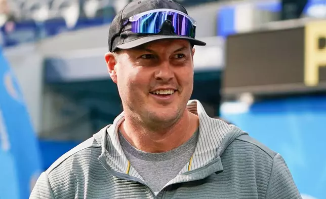 FILE - Former Los Angeles Chargers quarterback Philip Rivers watches warmups before an NFL football game between the Chargers and the Denver Broncos, Dec. 10, 2023, in Inglewood, Calif. (AP Photo/Ryan Sun, File)