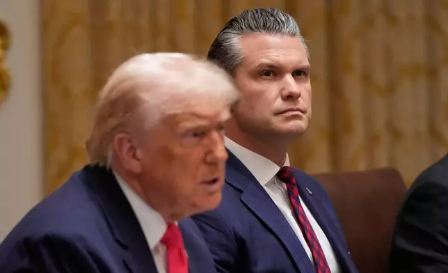 President Donald Trump speaks during a Cabinet meeting at the White House, Tuesday, Dec. 2, 2025, in Washington, as Defense Secretary Pete Hegseth looks on. (AP Photo/Julia Demaree Nikhinson)