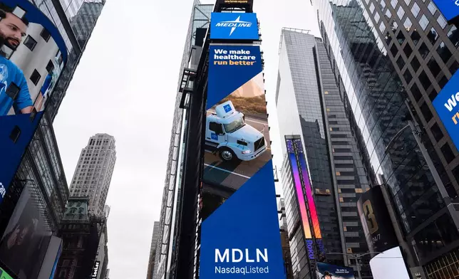 Medline Industries signage is displayed outside the Nasdaq MarketSite, Wednesday, Dec. 17, 2025, in New York. (AP Photo/Yuki Iwamura)