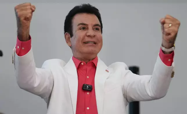 Presidential candidate Salvador Nasralla, of the Liberal Party, celebrates after the first official preliminary results were announced during general elections in Tegucigalpa, Honduras, Sunday, Nov. 30, 2025. (AP Photo/Moises Castillo)