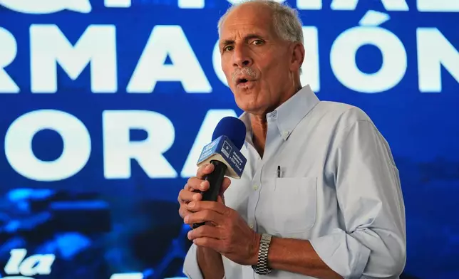 Presidential candidate Nasry Asfura, of the National Party, gives a press conference in Tegucigalpa, Honduras, Monday, Dec. 1, 2025. (AP Photo/Moises Castillo)