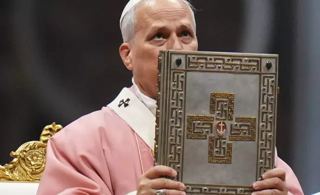 Pope Leo XIV celebrates a Mass on the occasion of the Jubilee of Prisoners in St. Peter's Basilica, at the Vatican, Sunday, Dec. 14, 2025. (AP Photo/Alessandra Tarantino)